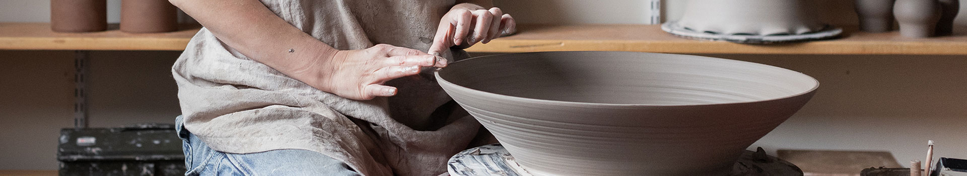 Classic Making a Pottery Bowl on the Pottery Wheel Stock Photo